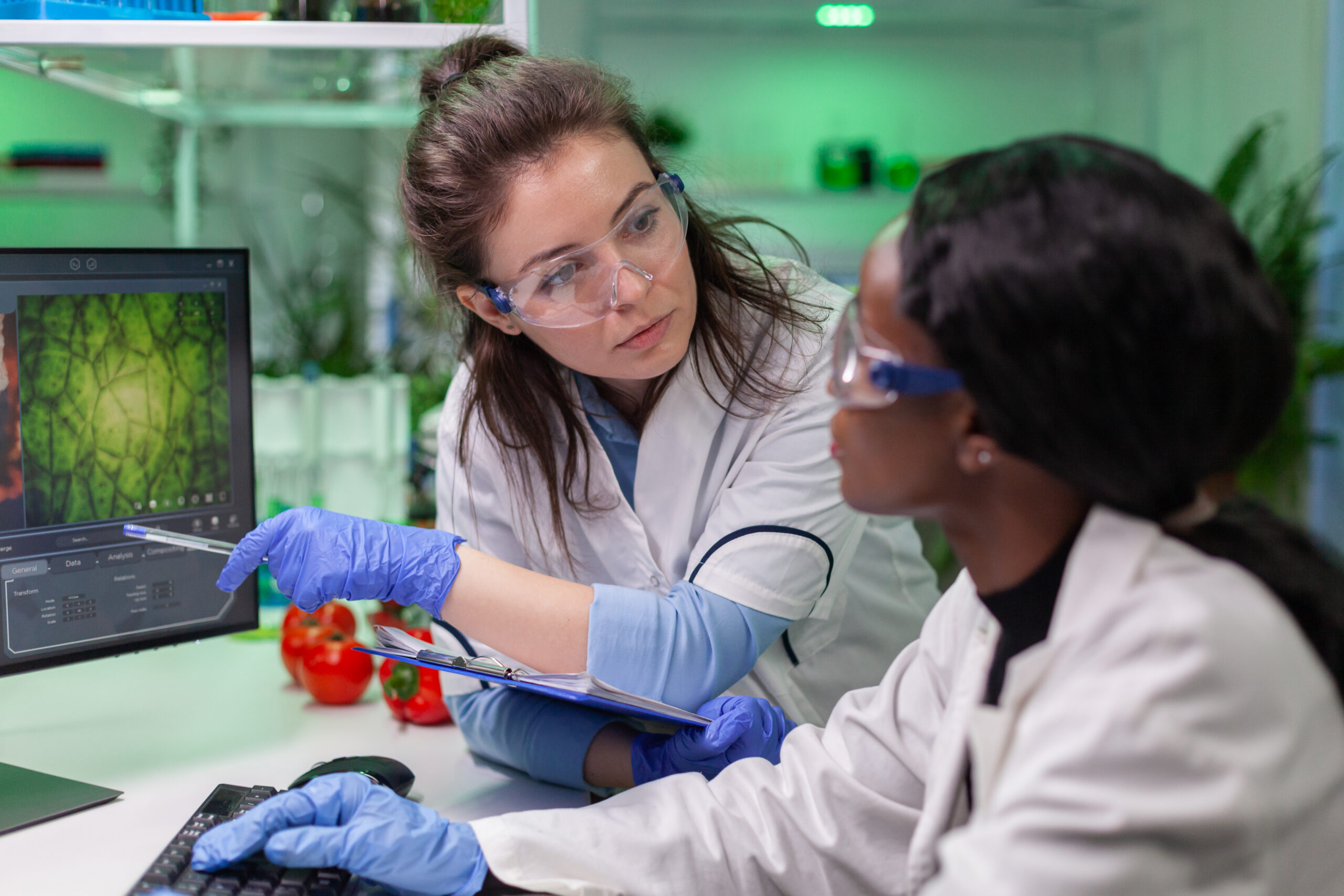 Diverse group of women in STEM working together in a laboratory