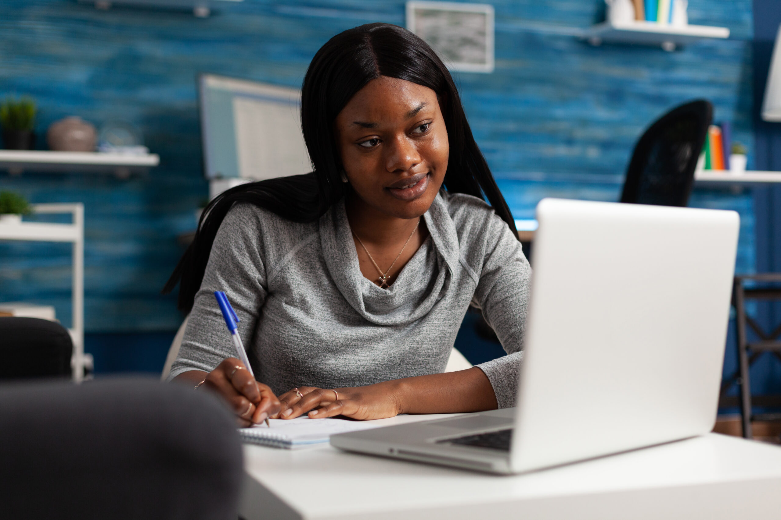 person taking free online courses with certificates on a laptop in 2027